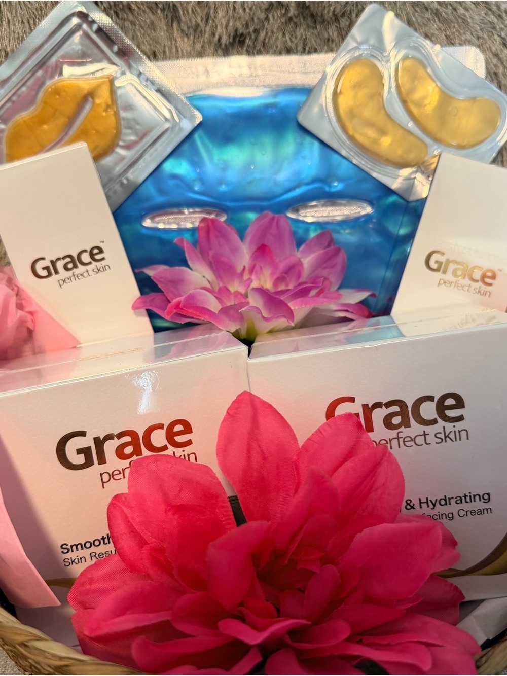 Grace skincare gift set with pink floral accents and blue gel